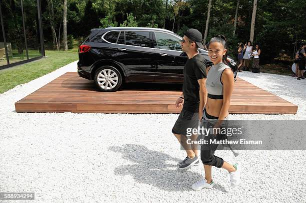Chris Stamp and Sharina Gutierrez attend the Buick celebration of the new Envision in the Hamptons at Buick Studio Envision on August 12, 2016 in...