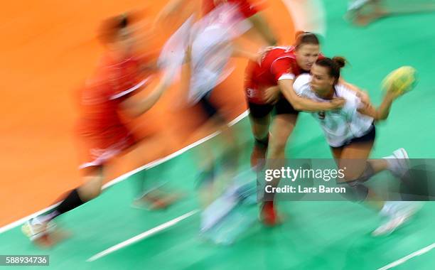 Durdina Jaukovic of Montenegro challenges Nora Mork of Norway during the Womens Preliminary Group A match between Montenegro and Norway on Day 7 of...