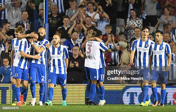 Glenn Murray of Brighton and Hove Albion celebrates with teammates after he scores his second and his sides third goal during the Sky Bet...