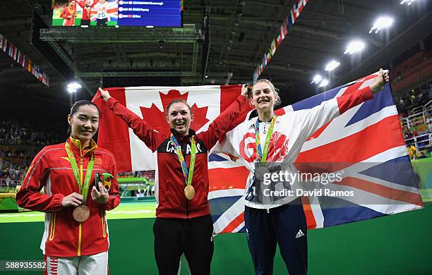 Bronze medalist Dan Li of China, gold medalist Rosannagh Maclennan of Canada and silver medalist Bryony Page of Great Britain pose after the medal...