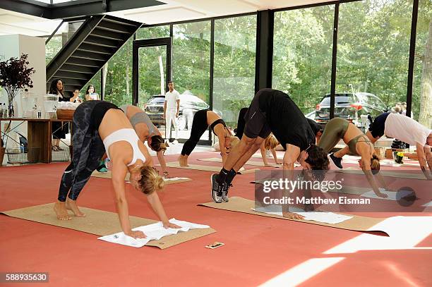 Jenne Lombardo, Akin Akman, and Nina Agdal work out at the Buick celebration of the new Envision in the Hamptons at Buick Studio Envision on August...