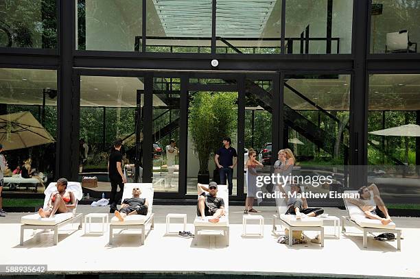Guests attend the Buick celebration of the new Envision in the Hamptons at Buick Studio Envision on August 12, 2016 in East Hampton, New York.