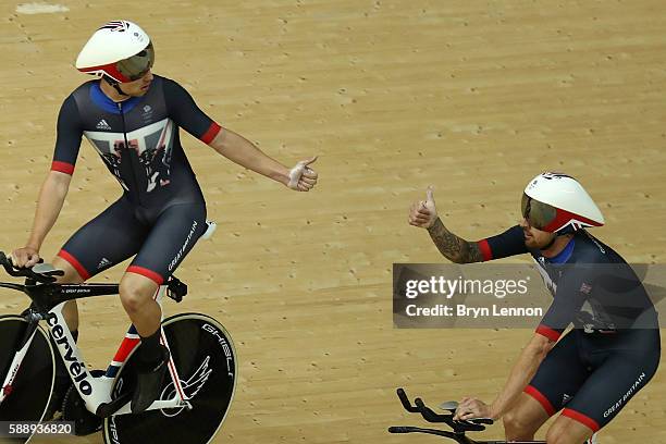 Edward Clancy, Steven Burke, Owain Doull and Bradley Wiggins of Team Great Britain celebrates setting the new world record of 3:50.570 after...