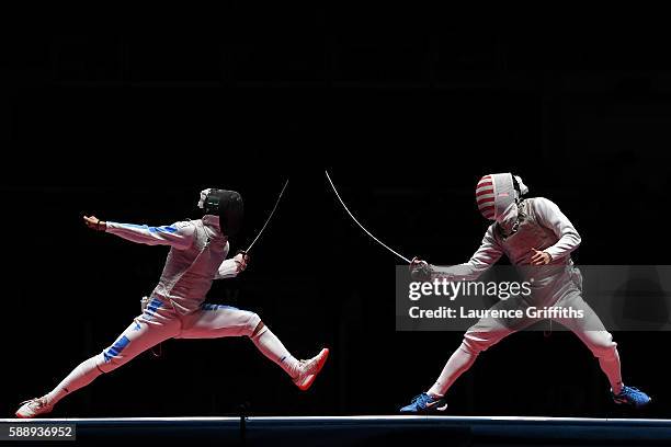 Andrea Baldini of Italy competes against Gerek Meinhardt of the United States during the Men's Foil Team Bronze Medal Match bout on Day 7 of the Rio...