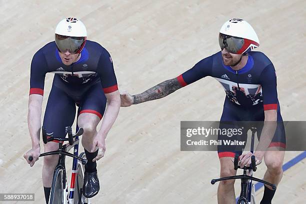 Edward Clancy, Steven Burke, Owain Doull and Bradley Wiggins of Team Great Britain celebrates setting the new world record of 3:50.570 after...