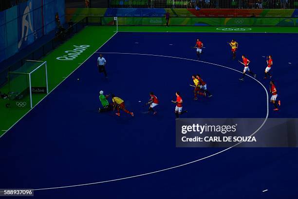 Spain's David Alegre scores a goal past Great Britain's George Pinner during the mens's field hockey Britain vs Spain match of the Rio 2016 Olympics...