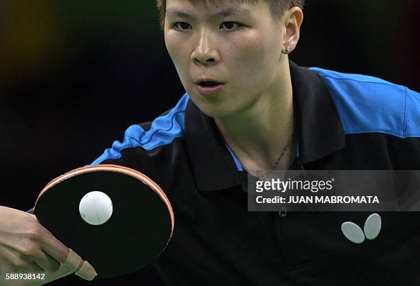 Taiwan's Chen Szu-Yu hits a shot in the women's team qualification round table tennis match against Hong Kong at the Riocentro venue during the Rio...