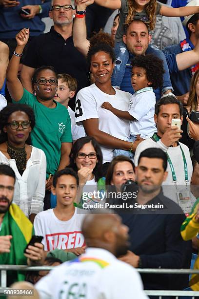 Teddy Riner's girlfriend Luthna Plocus and son Eden attend the Men's +100kg Judo finals on Day 7 of the Rio 2016 Olympic Games at Carioca Arena 2 on...