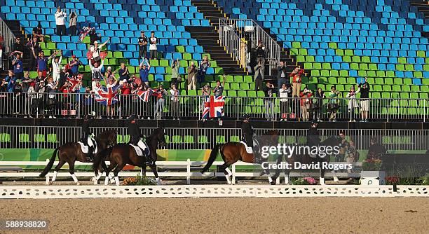 The Great Britain team, who won the team silver medal celebrate during the final day of the Dressage Grand Prix event on Day 7 of the Rio 2016...