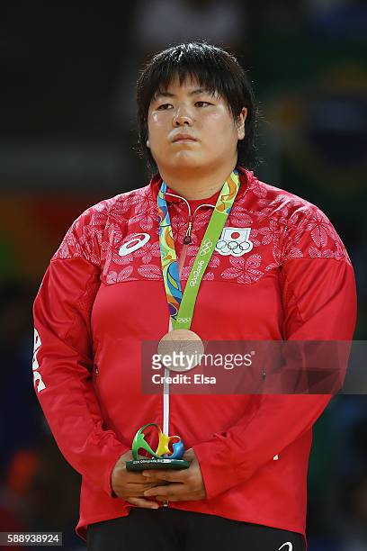 Bronze medalist Kanae Yamabe of Japan celebrates on the podium after the Women's +78kg Judo contest on Day 7 of the Rio 2016 Olympic Games at Carioca...