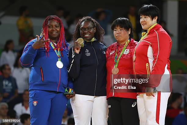 Gold medalist Emilie Andeol of France, silver medalist Idalys Ortiz of Cuba, bronze medalists Kanae Yamabe of Japan and Song Yu of China celebrate...