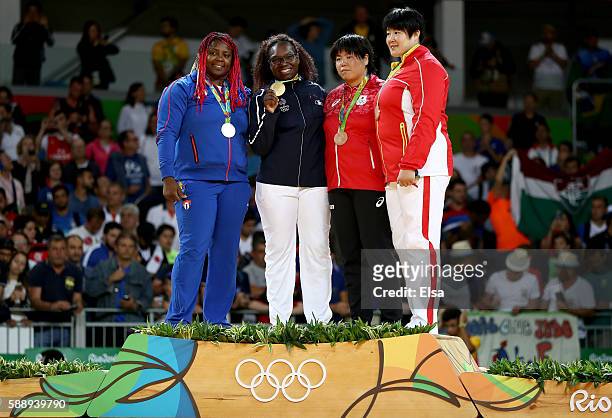 Gold medalist Emilie Andeol of France, silver medalist Idalys Ortiz of Cuba, bronze medalists Kanae Yamabe of Japan and Song Yu of China celebrate...