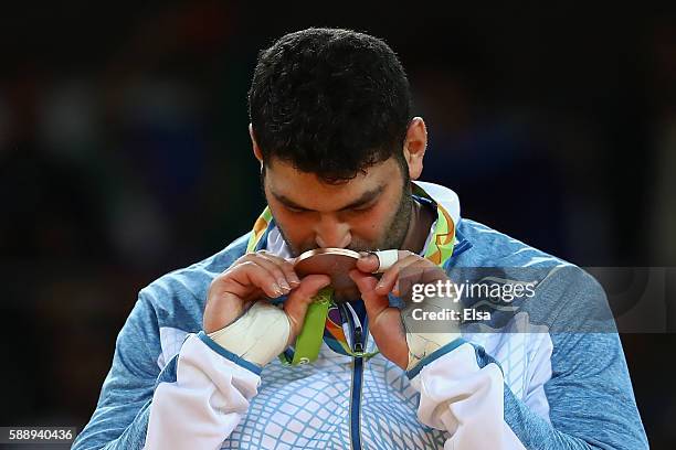 Bronze medalist Or Sasson of Israel kisses his medal on the podium during the Men's +100kg Judo contest on Day 7 of the Rio 2016 Olympic Games at...