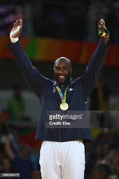 Gold medalist Teddy Riner of France celebrates on the podium after defeating Hisayoshi Harasawa of Japan during the Men's +100kg Judo Gold Medal...