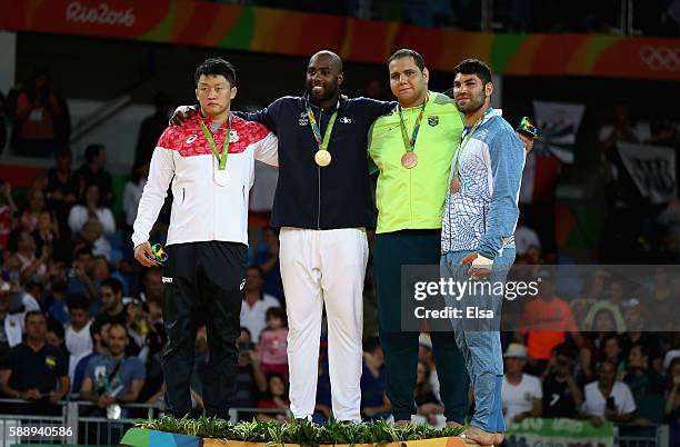 Silver medalist Hisayoshi Harasawa of Japan, gold medalist Teddy Riner of France, and bronze medalists Rafael Silva of Brazil and Or Sasson of Israel...