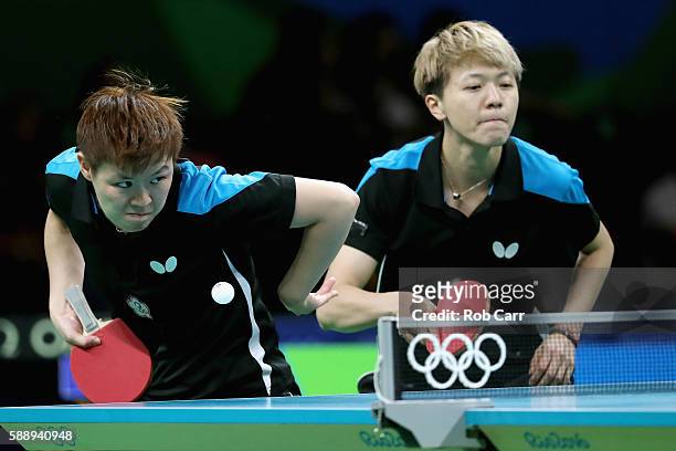 Huang Yi-Hua and Chen Szu-Yu of Chinese Taipei play a shot against Hong Kong during the Womens' Team Round 1 on Day 7 of the Rio 2016 Olympic Games...