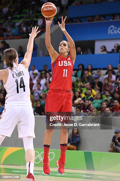 Elena Delle Donne of the USA Basketball Women's National Team shoots the ball against Katherine Plouffe of Canada on Day 7 of the Rio 2016 Olympic...