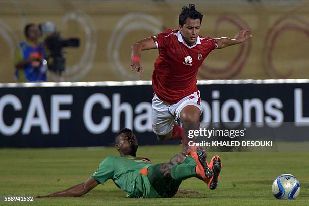 Al-Ahly's Amr Gamal vies with Zesco United's Adama Ben Bahn during the Confederation of African Football Champions League group A match between...