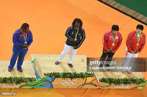 Cuba's Idalys Ortiz , France's Emilie Andeol , Japan's Kanae Yamabe and China's Yu Song celebrate on the podium of the women's +78kg judo contest of...