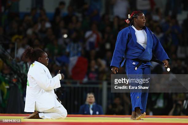 Emilie Andeol of France celebrates after defeating Idalys Ortiz of Cuba during the Women's +78kg Judo Gold Medal contest on Day 7 of the Rio 2016...