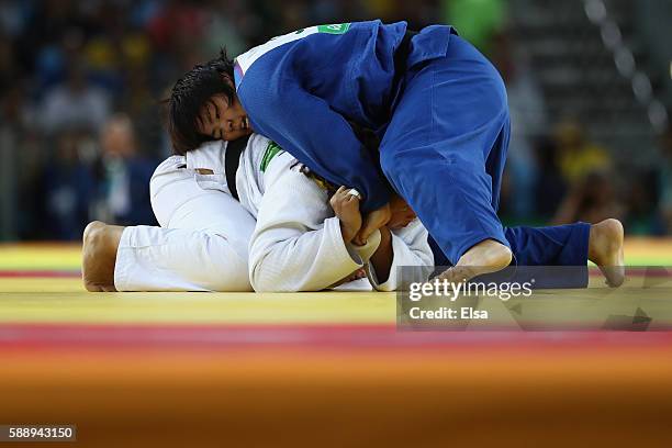 Kanae Yamabe of Japan and Kayra Sayit of Turkey compete during the Women's +78kg Judo contest on Day 7 of the Rio 2016 Olympic Games at Carioca Arena...