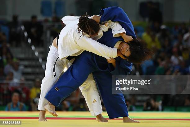 Kanae Yamabe of Japan and Kayra Sayit of Turkey compete during the Women's +78kg Judo contest on Day 7 of the Rio 2016 Olympic Games at Carioca Arena...