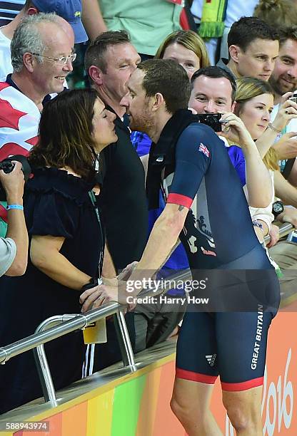 Bradley Wiggins of Team Great Britain kisses his wife Catherine to celebrate winning the gold medal after the Men's Team Pursuit Final for Gold on...