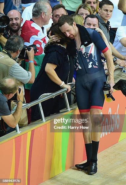 Bradley Wiggins of Team Great Britain kisses his wife Catherine to celebrate winning the gold medal after the Men's Team Pursuit Final for Gold on...