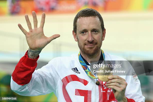 Gold medalist Bradley Wiggins of Team Great Britain poses for photographs with his fifth gold medal in his career after at the medal ceremony for the...