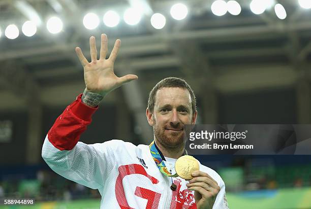 Gold medalist Bradley Wiggins of Team Great Britain poses for photographs with his fifth gold medal in his career after at the medal ceremony for the...