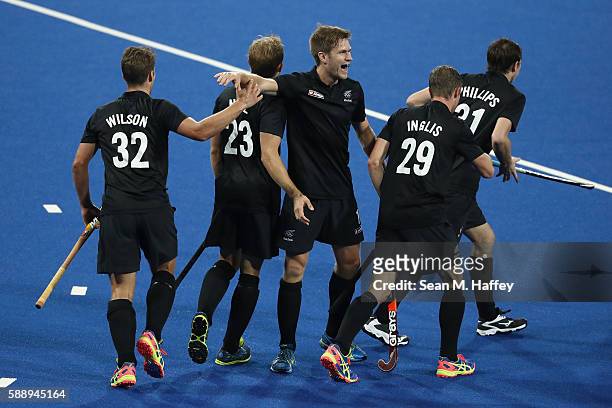 Nick Wilson, Hugo Inglis, Shay Neal and Kane Russell of New Zealand react to a goal against Belgium during a Men's Preliminary Pool B match on Day 7...