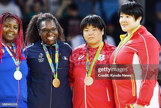 Gold medalist Emilie Andeol of France , silver medalist Idalys Ortiz of Cuba and bronze medalists Kanae Yamabe of Japan and Yu Song of China stand...