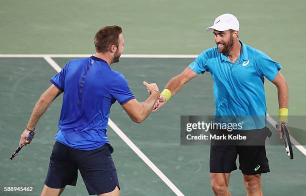 Jack Sock and Steve Johnson of the United States celebrate match point in the Men's Doubles Bronze medal match against Vasek Pospisil and Daniel...