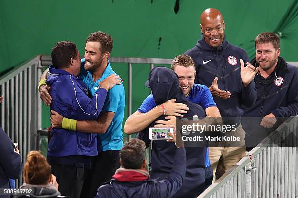 Steve Johnson and Jack Sock of the United States celebrating match point in the Men's Doubles Bronze medal match against Vasek Pospisil and Daniel...