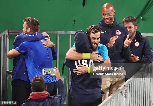 Jack Sock and Steve Johnson of the United States celebrate match point in the Men's Doubles Bronze medal match against Vasek Pospisil and Daniel...