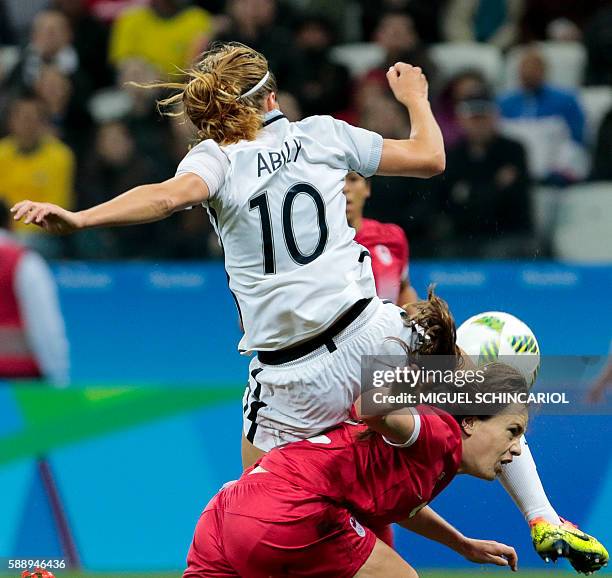 Canada's Allysha Chapman and France's Camille Abily vie for the ball during their Rio 2016 Olympic Games women's football quarterfinal match at the...