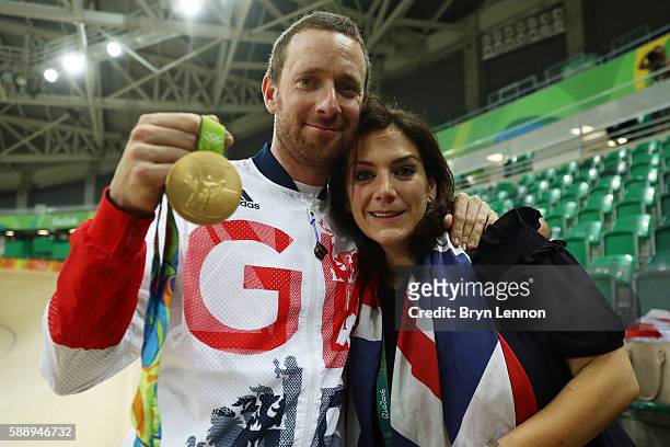 Gold medalist Bradley Wiggins of Team Great Britain and his wife Catherine pose for photographs after at the medal ceremony for the Men's Team...