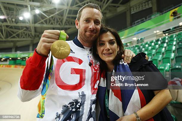 Gold medalist Bradley Wiggins of Team Great Britain and his wife Catherine pose for photographs after at the medal ceremony for the Men's Team...