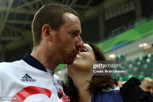 Gold medalist Bradley Wiggins of Team Great Britain and his wife Catherine kiss after at the medal ceremony for the Men's Team Pursuit Final for Gold...