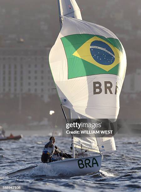 Brazil's Ana Luiza Barbachan and Brazil's Fernanda Oliveira compete in the 470 Women sailing class on Guanabara Bay in Rio de Janerio during the Rio...