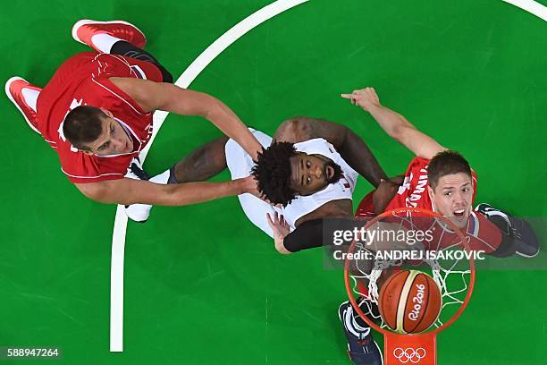 An overview shows Serbia's power forward Nikola Jokic , USA's centre DeAndre Jordan and Serbia's centre Vladimir Stimac eye a rebound during a Men's...