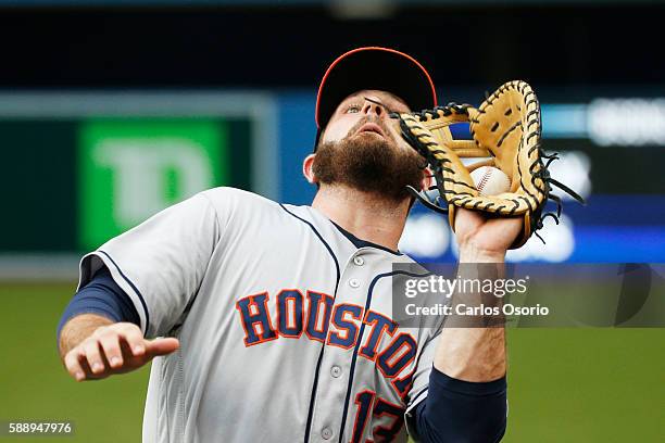 Astros 1B Tyler White catches a pop foul during the 1st inning as the Toronto Blue Jays host the Houston Astros at the Rogers Centre on August 12,...