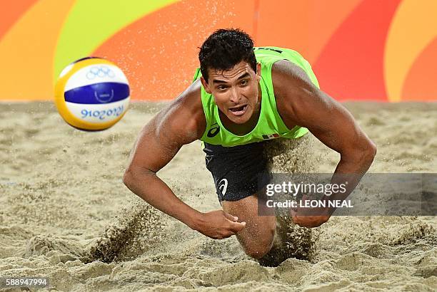 Mexico's Rodolfo Lombardo Ontiveros Gomez dives for the ball during the men's beach volleyball round of 16 match between Mexico and the Netherlands...