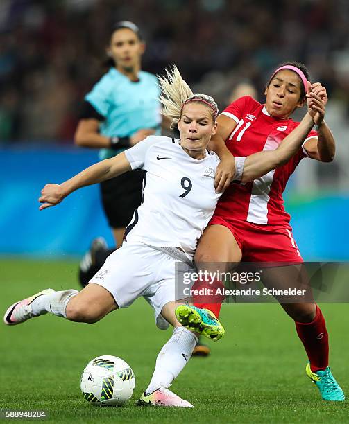 Eugenie le Sommer of France and Desiree Scott of Canada in action during the match between Canada and France womens football quarter final for the...