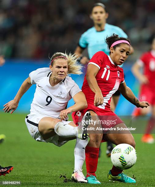Eugenie le Sommer of France and Desiree Scott of Canada in action during the match between Canada and France womens football quarter final for the...