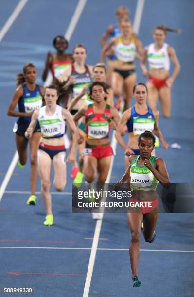 Ethiopia's Dawit Seyaum leads the field in the Women's 1500m Round 1 during the athletics event at the Rio 2016 Olympic Games at the Olympic Stadium...