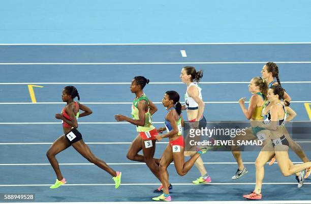 Ethiopia's Dawit Seyaum , Kenya's Viola Cheptoo, and USA's Shannon Rowbury compete in the Women's 1500m Round 1 during the athletics event at the Rio...