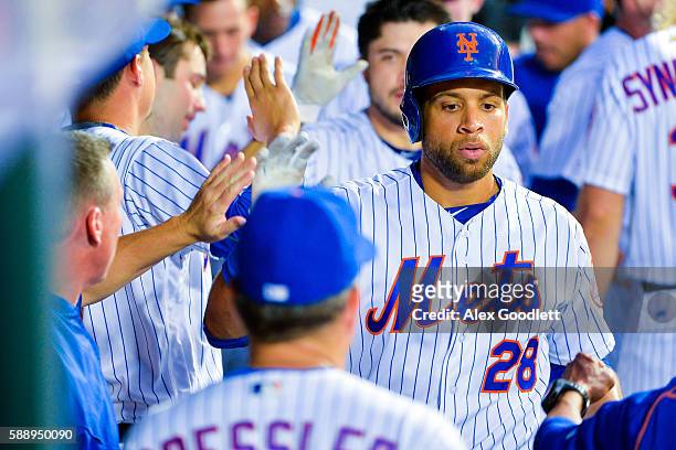 James Loney of the New York Mets celebrates after scoring in the bottom of the second inning during a game against the San Diego Padres at Citi Field...