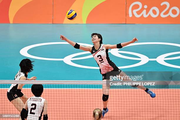 Japan's Saori Kimura plays a shot during the women's qualifying volleyball match between Russia and Japan at the Maracanazinho stadium in Rio de...