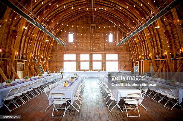 barn interior set up for a wedding reception - wedding reception stock pictures, royalty-free photos & images